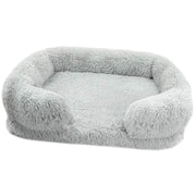 Soft gray orthopedic soft dog sofa bed with plush cushioning and raised edges for medium-sized dogs