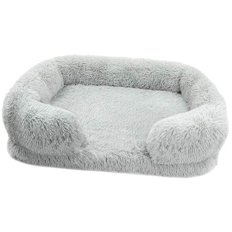 Soft gray orthopedic soft dog sofa bed with plush cushioning and raised edges for medium-sized dogs