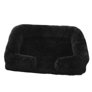 Soft black orthopedic dog sofa bed with plush cushioning and raised edges for medium-sized dogs.