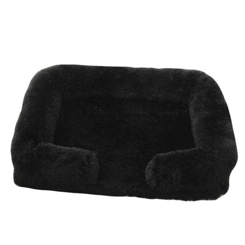 Soft black orthopedic dog sofa bed with plush cushioning and raised edges for medium-sized dogs.