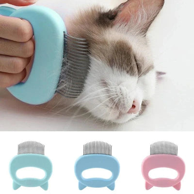 Cat Grooming & Massage Comb with non-slip handle grooming a relaxed cat and available in blue and pink colors