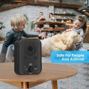 Ultrasonic dog bark stopper device on table with children petting dog, safe for people and animals