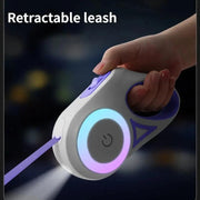 Automatic retractable dog leash with LED flashlight and colorful glowing ring for nighttime walks