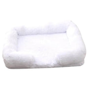 Soft white orthopedic dog sofa bed with plush cushioning and raised edges for medium-sized dogs