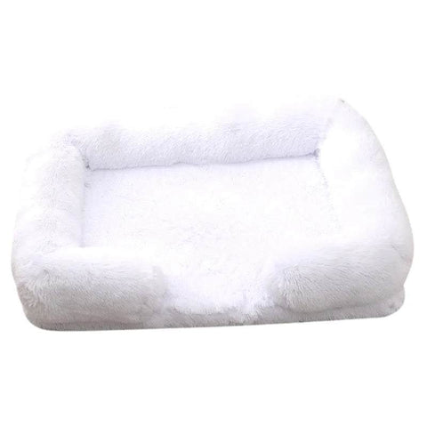 Soft white orthopedic dog sofa bed with plush cushioning and raised edges for medium-sized dogs
