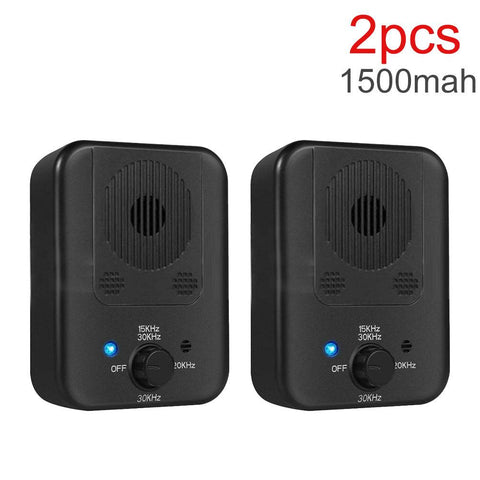 Set of two black ultrasonic dog bark stopper devices with adjustable frequency and LED indicator light.